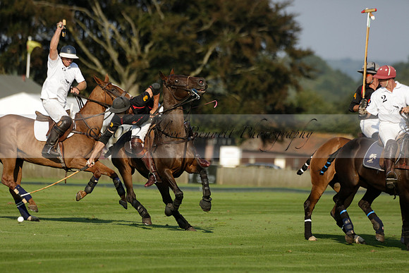 Pluma Negra (white) v Shoreline (black) in the Brecknock Cup Subsidiary final polo match played on Sunday 25 August 2013 at Cowdray Park Polo Club on Ambersham 1. 2013.10.12 www.polopictures.co.uk