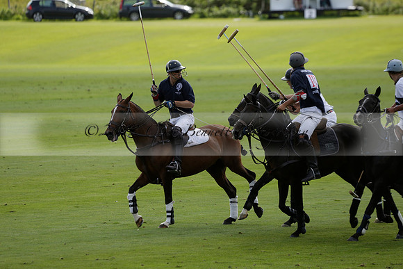 Pandas (white) v Home Farm (navy) in a Park House West Sussex Cup Polo match on Brooksfield at Cowdray Park Polo Club on Friday 30 August 2013. 2013.08.30 www.polopictures.co.uk