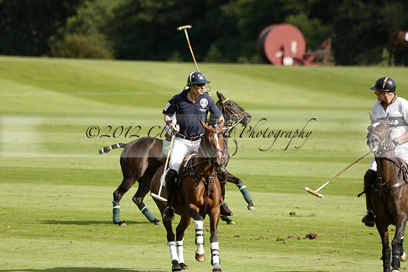 Pandas (white) v Home Farm (navy) in a Park House West Sussex Cup Polo match on Brooksfield at Cowdray Park Polo Club on Friday 30 August 2013. 2013.08.30 www.polopictures.co.uk