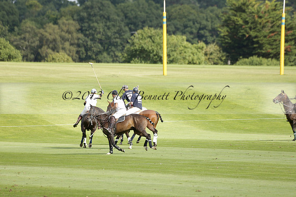 Pandas (white) v Home Farm (navy) in a Park House West Sussex Cup Polo match on Brooksfield at Cowdray Park Polo Club on Friday 30 August 2013. 2013.08.30 www.polopictures.co.uk