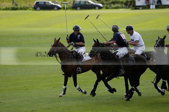 Pandas (white) v Home Farm (navy) in a Park House West Sussex Cup Polo match on Brooksfield at Cowdray Park Polo Club on Friday 30 August 2013. 2013.08.30 www.polopictures.co.uk