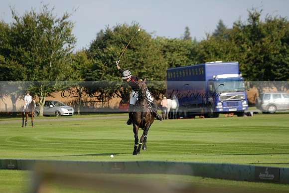Pluma Negra (white) v Shoreline (black) in the Brecknock Cup Subsidiary final polo match played on Sunday 25 August 2013 at Cowdray Park Polo Club on Ambersham 1. 2013.10.12 www.polopictures.co.uk