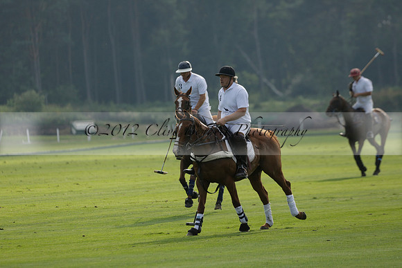 Pluma Negra (white) v Shoreline (black) in the Brecknock Cup Subsidiary final polo match played on Sunday 25 August 2013 at Cowdray Park Polo Club on Ambersham 1. 2013.10.12 www.polopictures.co.uk