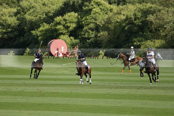 Pandas (white) v Home Farm (navy) in a Park House West Sussex Cup Polo match on Brooksfield at Cowdray Park Polo Club on Friday 30 August 2013. 2013.08.30 www.polopictures.co.uk