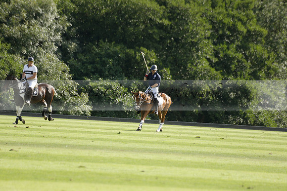 Pandas (white) v Home Farm (navy) in a Park House West Sussex Cup Polo match on Brooksfield at Cowdray Park Polo Club on Friday 30 August 2013. 2013.08.30 www.polopictures.co.uk
