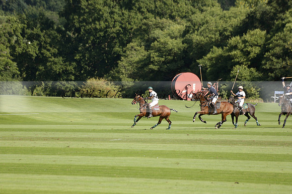 Pandas (white) v Home Farm (navy) in a Park House West Sussex Cup Polo match on Brooksfield at Cowdray Park Polo Club on Friday 30 August 2013. 2013.08.30 www.polopictures.co.uk