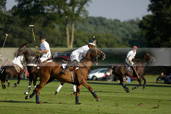 Pluma Negra (white) v Shoreline (black) in the Brecknock Cup Subsidiary final polo match played on Sunday 25 August 2013 at Cowdray Park Polo Club on Ambersham 1. 2013.10.12 www.polopictures.co.uk
