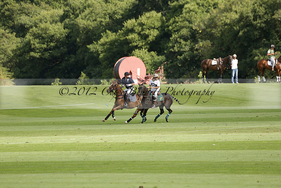 Pandas (white) v Home Farm (navy) in a Park House West Sussex Cup Polo match on Brooksfield at Cowdray Park Polo Club on Friday 30 August 2013. 2013.08.30 www.polopictures.co.uk