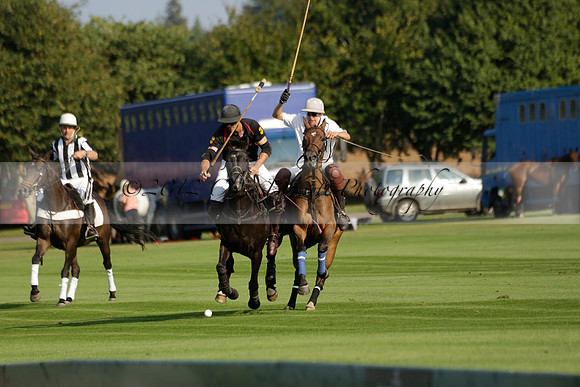 Pluma Negra (white) v Shoreline (black) in the Brecknock Cup Subsidiary final polo match played on Sunday 25 August 2013 at Cowdray Park Polo Club on Ambersham 1. 2013.10.12 www.polopictures.co.uk