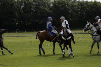 Combe Place (blue) v Silver Fox (white) in a Park House West Sussex Cup Polo match on Ambersham 1 at Cowdray Park Polo Club on Friday 30 August 2013. 2013.08.30 www.polopictures.co.uk