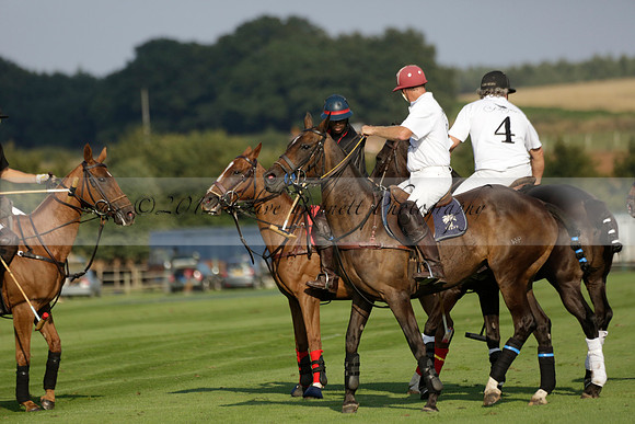 Pluma Negra (white) v Shoreline (black) in the Brecknock Cup Subsidiary final polo match played on Sunday 25 August 2013 at Cowdray Park Polo Club on Ambersham 1. 2013.10.12 www.polopictures.co.uk