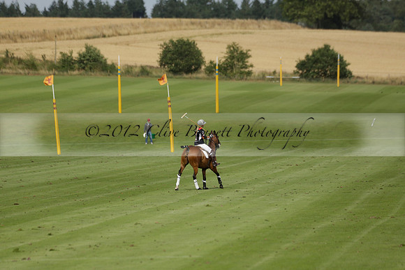 Jaeger Le Coultre (black)  v Wairakei Pastoral (white) in a Jaeger Le Coultre Holden White Cup polo match played on 29 July 2013 at Cowdray Park Polo Club on Brooksfieldwww.polopictures.co.uk