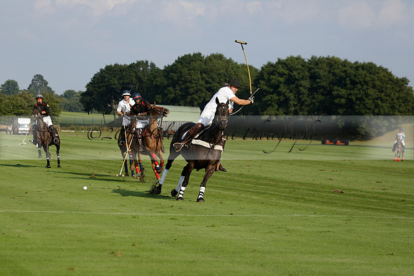 Pluma Negra (white) v Shoreline (black) in the Brecknock Cup Subsidiary final polo match played on Sunday 25 August 2013 at Cowdray Park Polo Club on Ambersham 1. 2013.10.12 www.polopictures.co.uk