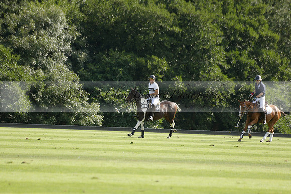 Pandas (white) v Home Farm (navy) in a Park House West Sussex Cup Polo match on Brooksfield at Cowdray Park Polo Club on Friday 30 August 2013. 2013.08.30 www.polopictures.co.uk