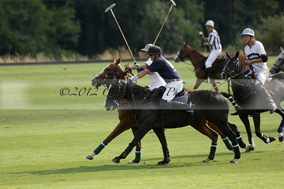 Pandas (white) v Home Farm (navy) in a Park House West Sussex Cup Polo match on Brooksfield at Cowdray Park Polo Club on Friday 30 August 2013. 2013.08.30 www.polopictures.co.uk