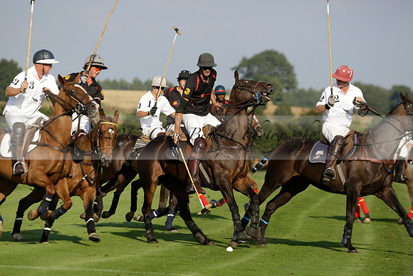 Pluma Negra (white) v Shoreline (black) in the Brecknock Cup Subsidiary final polo match played on Sunday 25 August 2013 at Cowdray Park Polo Club on Ambersham 1. 2013.10.12 www.polopictures.co.uk