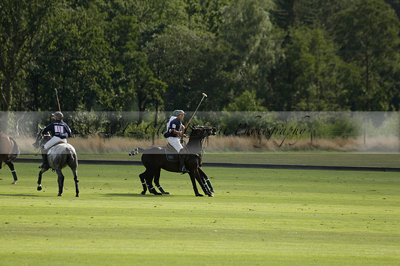 Pandas (white) v Home Farm (navy) in a Park House West Sussex Cup Polo match on Brooksfield at Cowdray Park Polo Club on Friday 30 August 2013. 2013.08.30 www.polopictures.co.uk