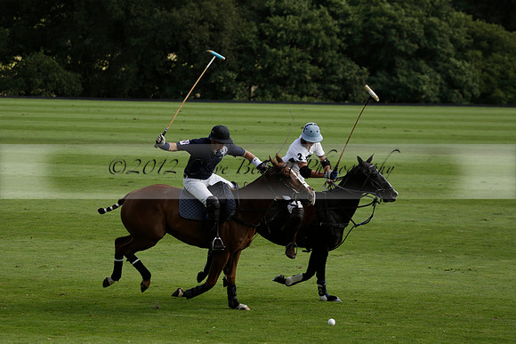 Pandas (white) v Home Farm (navy) in a Park House West Sussex Cup Polo match on Brooksfield at Cowdray Park Polo Club on Friday 30 August 2013. 2013.08.30 www.polopictures.co.uk