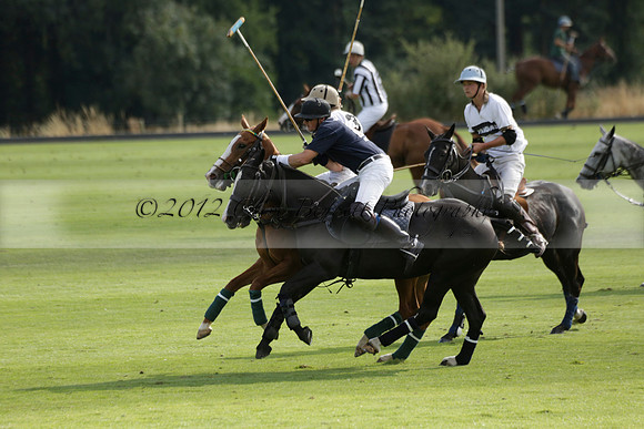 Pandas (white) v Home Farm (navy) in a Park House West Sussex Cup Polo match on Brooksfield at Cowdray Park Polo Club on Friday 30 August 2013. 2013.08.30 www.polopictures.co.uk